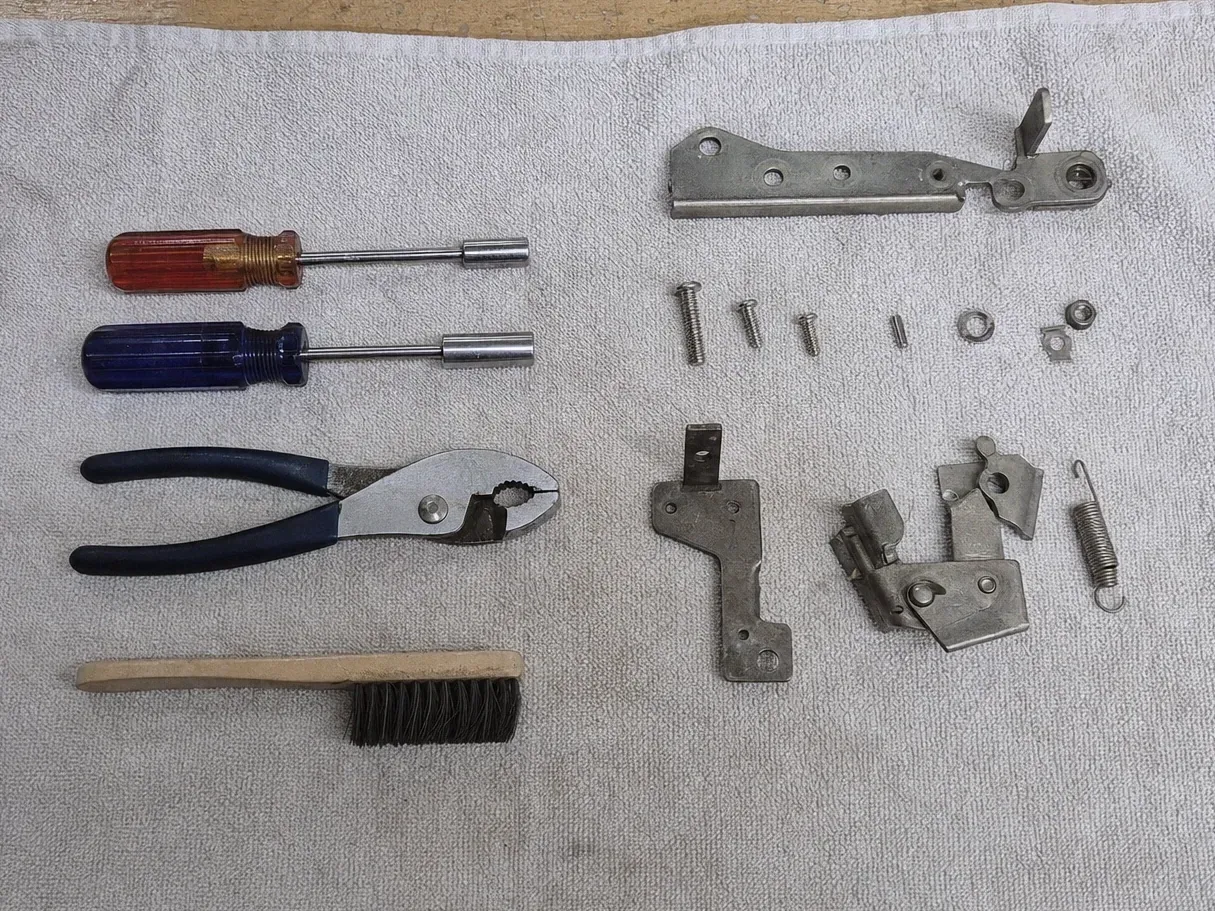 Latch parts with spring, nut drivers, pliers and wire brush
